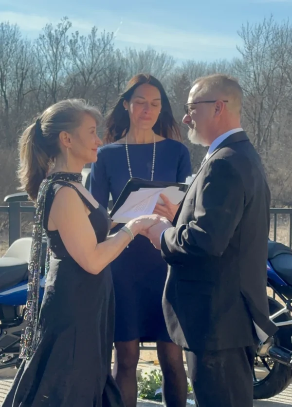 Image: Denise officiating a couple's wedding outdoors