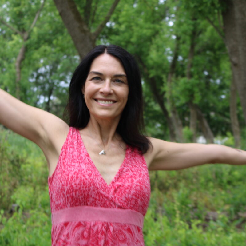 Denise with her arms stretched out feeling the freedom